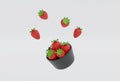3D rendering floating strawberries with strawberry leaf in black bowl on white background