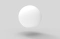 3d rendering. Floating white sphere with shadow on the floor background. Royalty Free Stock Photo