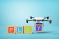 3d rendering of four colorful ABC blocks forming word `PLAY`, quadcopter with camera putting final letter Y at the end Royalty Free Stock Photo