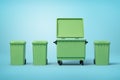 3d rendering of four green trash cans standing in row on light-blue background, three smaller cans closed and one big Royalty Free Stock Photo