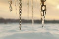 3d rendering of frozen chains and icicles in front of snow covered fields