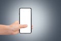 3D Rendering of Full Screen Phone Mock Up and Hand Holding on Dark