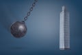 3d rendering of a giant iron wrecking ball swings on its chain in the direction of a tall glass skyscraper.