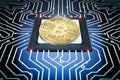 Gold bitcoin on circuit board