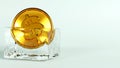 3D rendering of golden coin in an ice cube, Economic slowdown and disruptions in the financial system are like being frozen