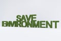3d rendering of green grass SAVE ENVIRONMENT text on white background