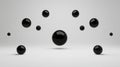 A 3D rendering of a group of black spheres arranged in a symmetrical pattern against a white background. Royalty Free Stock Photo