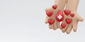 3D Rendering of hand holding blood drop with red cross sign Royalty Free Stock Photo