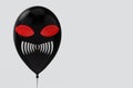 3d rendering. horror Halloween devil face black balloon with clipping path on gray copy space background