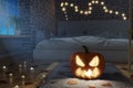 3d rendering of illuminated jack o` lantern standing on rug sofa