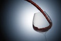 3D rendering : illustration of close up pouring red wine into a wine glass against light drop design background