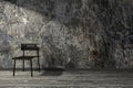 3D rendering : illustration, minimalism loft style interior,black chair on a wooden floor against stone wall Royalty Free Stock Photo