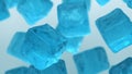 3D rendering illustration. Pieces of crushed blue cubes isolated ice on white and grey background. Irregular shaped with reflectio Royalty Free Stock Photo