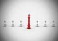 3D rendering illustration of red chess king figure among white pawns on a white background Royalty Free Stock Photo