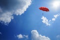 3D Rendering : illustration of Red umbrella floating above against blue sky and clouds. Business, leader concept, being different
