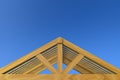 3d rendering. incomplete building new gable roof wood house construction work with clipping path isolated on blue sky background. Royalty Free Stock Photo