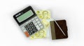 isolated composition of Singapore dollar notes, a calculator, a note book and a pen Royalty Free Stock Photo