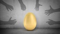 3d rendering of a large golden egg stands on a grey concrete background with many shadow arms trying to grab and