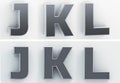 3d rendering of the letters J, K, L in blushed metal of a white isolated background. 3D render. Royalty Free Stock Photo