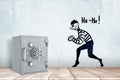 3d rendering of a light-grey metal safe on a wooden surface near a wall with a drawing of a tiptoeing thief and words He