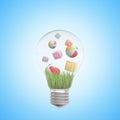 3d rendering of lightbulb with inflatable balls and ABC blocks inside on light-blue background.