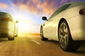 Low angle view of cars on motion on the road at sunset Royalty Free Stock Photo