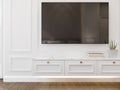 3D rendering of low cabinet with TV on classic white wall Royalty Free Stock Photo