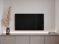 3D rendering of low cabinet with TV on white wall Royalty Free Stock Photo