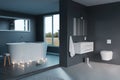 3d rendering of of luxury grey bathroom with free standing bathtub and candle lights