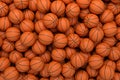 3d rendering of many orange basketball balls lying in an endless pile seen from the top.