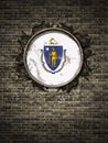 Old Massachusetts flag in brick wall Royalty Free Stock Photo