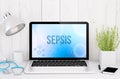 Medical desktop computer with sepsis on screen