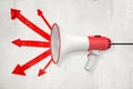 3d rendering of megaphone against wall with five red arrows diverging from its center. Royalty Free Stock Photo