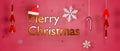 3D Rendering of Merry Christmas golden text  Snow flakes  santa hat and christmas tree on red background. For a card or a banner. Royalty Free Stock Photo