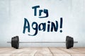 3d rendering of metal training bar-bell on white wooden floor with `Try again` sign on white wall