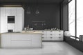 3d rendering modern loft black kitchen and dining room in winter