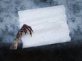 3D rendering of monster hand holding blank white sign Royalty Free Stock Photo
