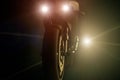 A motorcycle being chased by a bright light at night