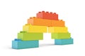 3d rendering of multi-colored toy blocks making up a rainbow bridge.