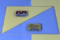 3d rendering Old audio tape compact cassette isolated on yellow and blue background Retro cassette tape collection top view Royalty Free Stock Photo
