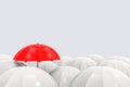 3d rendering. one red umbrella is higher than the others on gray copy space background. outstanding in business concept Royalty Free Stock Photo