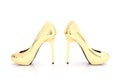 3D rendering of a pair of golden high heels