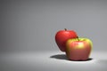 3d rendering of pair of ripe delicious apples on a gray background