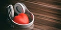 3d rendering pair of wireless headphones and a red heart
