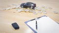 3D Rendering. Pen on Clipboard with the key and  black car a lot of coins on background. Car loan concept Royalty Free Stock Photo