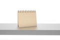3D Rendering Notebook or Desk Calendar on Shelf
