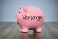 piggy bank with the word precaution in german language