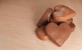 Milk chocolate hearts on table