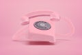 3d rendering of pink retro telephone on pink background Royalty Free Stock Photo