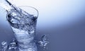 3D Rendering of Pour water on glass with reflection on table surface